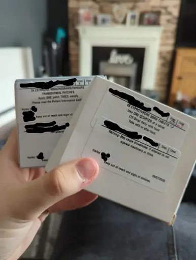 Two boxes of medication, one reads "ESTRADIOL TRANSDERMAL PATCH 50MG" and the other "CYPROTERONE ACETATE TABLETS 50MG", both in black, block writing.