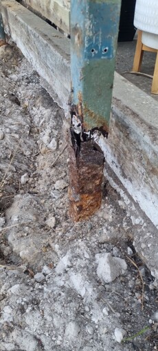 Post intended to support patio roof rusted right through.